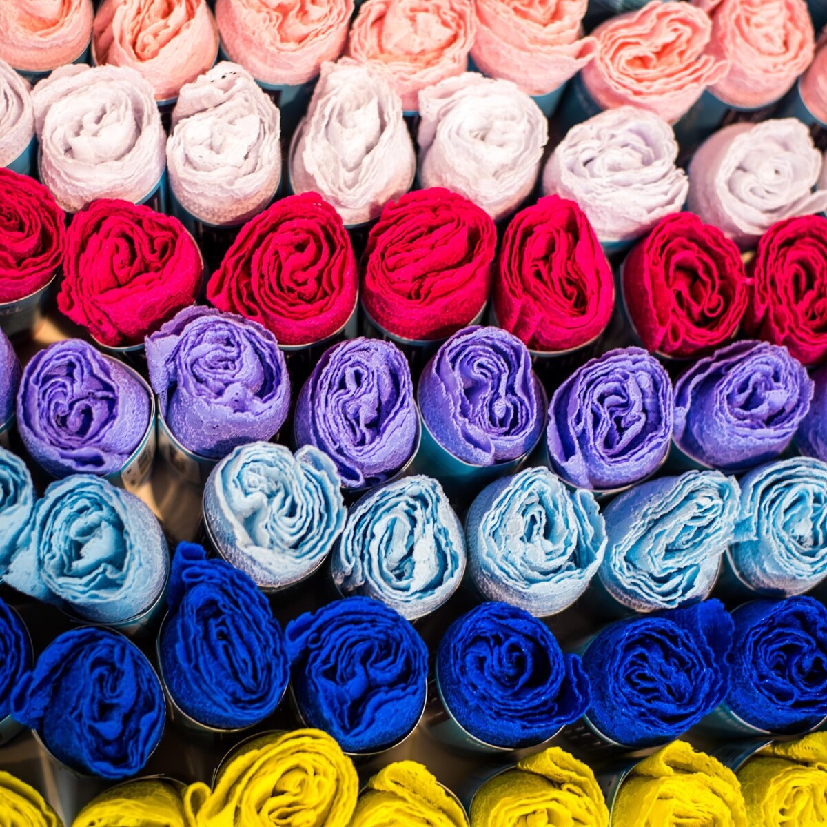 dyed fabric stacked in roll form